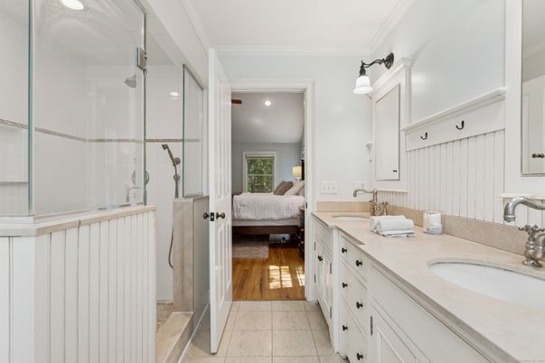 Bathroom, Bedroom, Dual Sink Vanities, Glass Shower, Interior, Recessed Lighting, Wood Texture Flooring