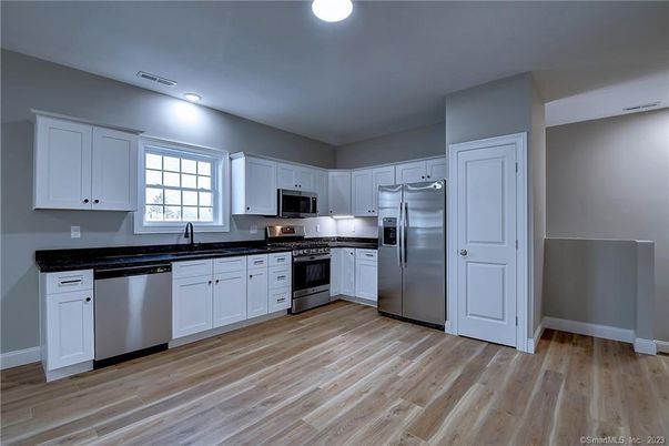 Interior, Kitchen, Recessed Lighting, Stainless Steel Appliances, Wood Texture Flooring