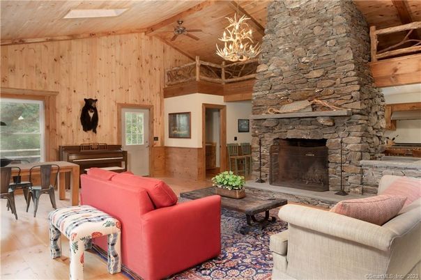 Chandelier, Fireplace, Interior, Living room, Pendant Lights, Piano, Stone Walls, Wooden Beams, Wooden Ceilings, Wood Texture Flooring, Wooden Walls