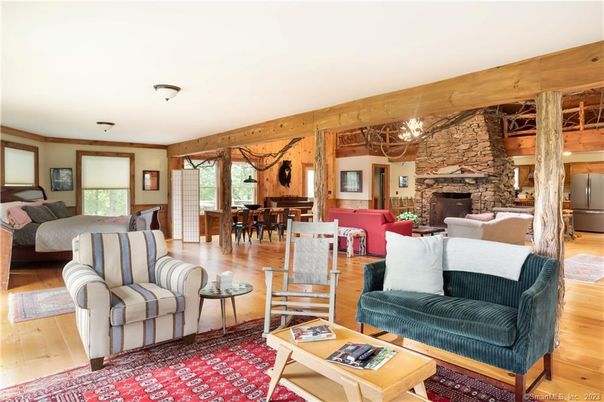 Chandelier, Dining room, Fireplace, Interior, Living room, Stone Walls, Wooden Beams, Wood Texture Flooring, Wooden Walls