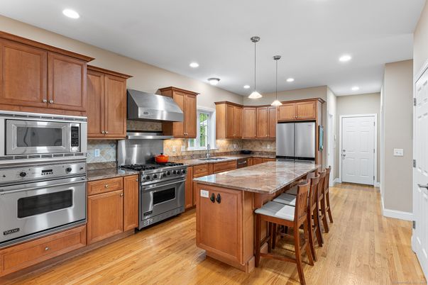 Interior, Kitchen, Pendant Lights, Recessed Lighting, Stainless Steel Appliances, Wood Texture Flooring