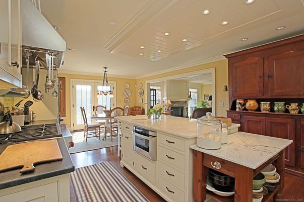 Chandelier, Dining room, Fireplace, Interior, Kitchen, Pendant Lights, Recessed Lighting, Wood Texture Flooring