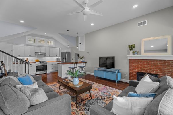 Fireplace, Interior, Kitchen, Living room, Pendant Lights, Recessed Lighting, Stainless Steel Appliances, Stone Walls, Wood Texture Flooring