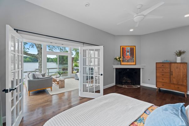 Bedroom, Fireplace, Interior, Recessed Lighting, Water, Wood Texture Flooring