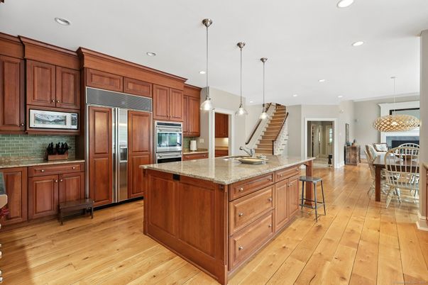Chandelier, Dining room, Interior, Kitchen, Pendant Lights, Recessed Lighting, Stainless Steel Appliances, Wood Texture Flooring