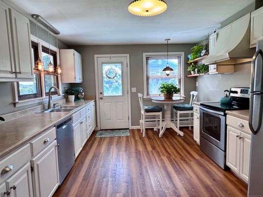 Dining room, Interior, Kitchen, Pendant Lights, Stainless Steel Appliances, Wood Texture Flooring