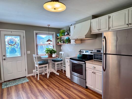 Dining room, Interior, Kitchen, Pendant Lights, Stainless Steel Appliances, Wood Texture Flooring