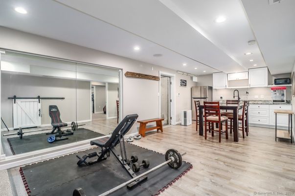 Dining room, Fitness Equipment, Interior, Kitchen, Recessed Lighting, Wood Texture Flooring