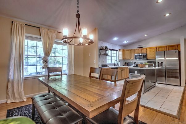 Dining room, Interior, Kitchen, Pendant Lights, Recessed Lighting, Stainless Steel Appliances, Wood Texture Flooring
