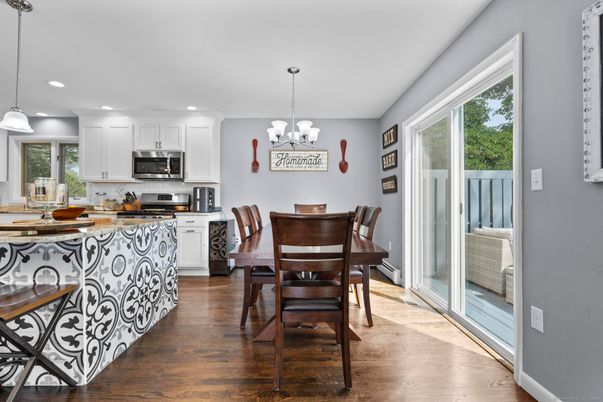 Chandelier, Dining room, Interior, Kitchen, Pendant Lights, Recessed Lighting, Stainless Steel Appliances, Wood Texture Flooring