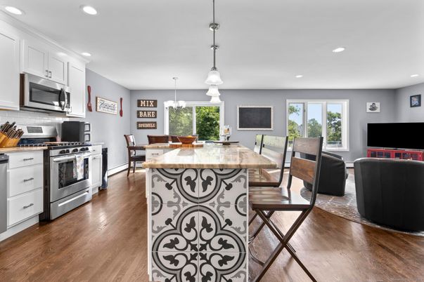 Dining room, Interior, Kitchen, Pendant Lights, Recessed Lighting, Stainless Steel Appliances, Wood Texture Flooring