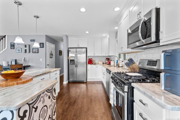 Interior, Kitchen, Pendant Lights, Recessed Lighting, Stainless Steel Appliances, Wood Texture Flooring