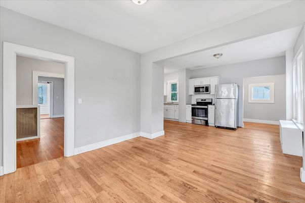Empty room, Interior, Kitchen, Stainless Steel Appliances, Wood Texture Flooring