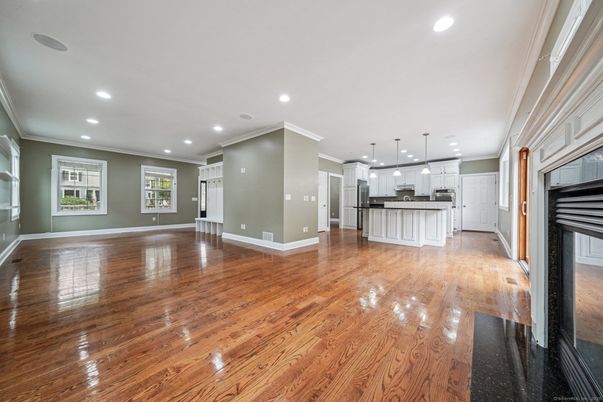 Empty room, Interior, Kitchen, Pendant Lights, Recessed Lighting, Stainless Steel Appliances, Wood Texture Flooring