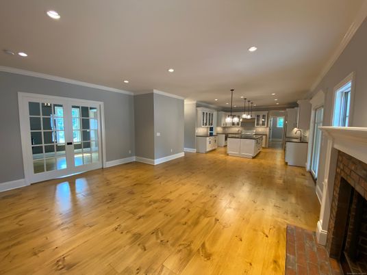 Empty room, Fireplace, Interior, Kitchen, Pendant Lights, Recessed Lighting, Wood Texture Flooring