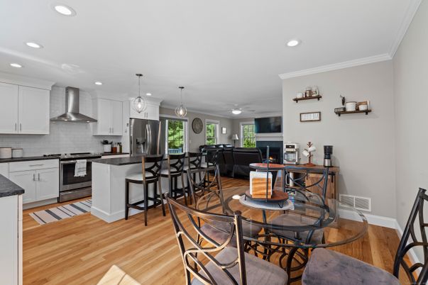 Dining room, Fireplace, Interior, Kitchen, Pendant Lights, Recessed Lighting, Stainless Steel Appliances, Wood Texture Flooring