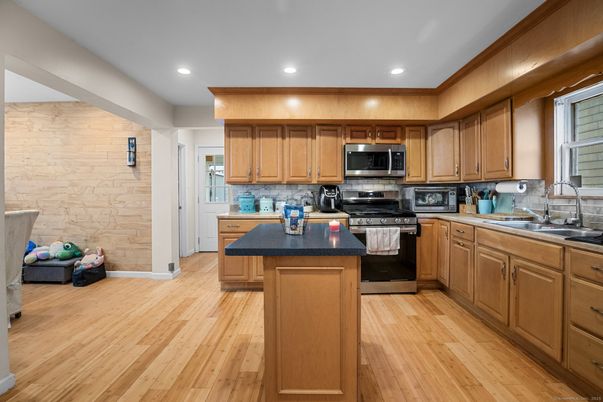 Interior, Kitchen, Recessed Lighting, Stainless Steel Appliances, Stone Walls, Wood Texture Flooring