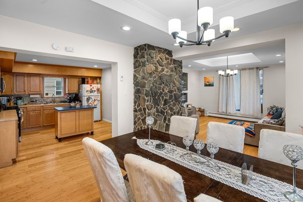 Chandelier, Dining room, Fireplace, Interior, Kitchen, Recessed Lighting, Stone Walls, Wood Texture Flooring