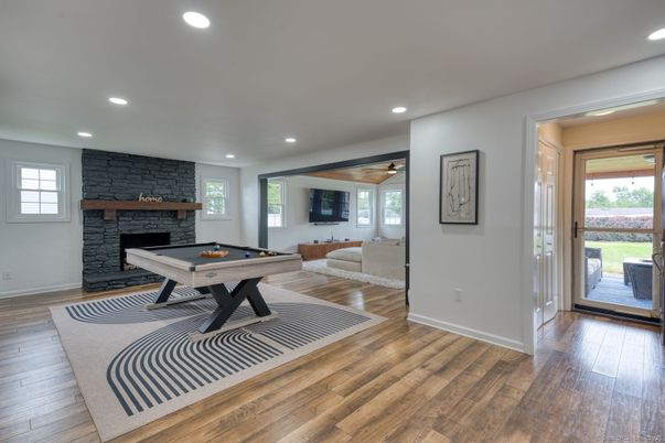 Billiard Table, Fireplace, Game Room, Interior, Recessed Lighting, Stone Walls, Wood Texture Flooring