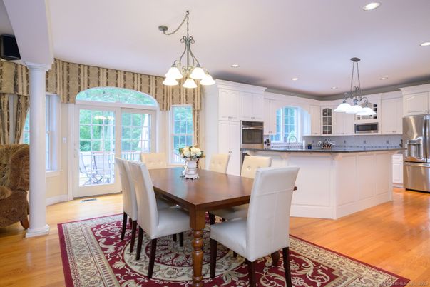 Chandelier, Dining room, Interior, Kitchen, Pendant Lights, Recessed Lighting, Stainless Steel Appliances, Wood Texture Flooring