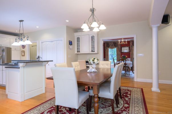 Chandelier, Dining room, Interior, Kitchen, Pendant Lights, Recessed Lighting, Stainless Steel Appliances, Wood Texture Flooring