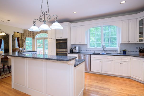 Chandelier, Interior, Kitchen, Pendant Lights, Recessed Lighting, Stainless Steel Appliances, Wood Texture Flooring