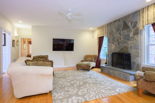 Fireplace, Interior, Living room, Recessed Lighting, Stone Walls, Wood Texture Flooring