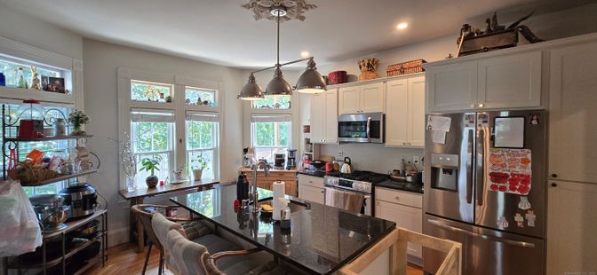 Dining room, Interior, Kitchen, Pendant Lights, Recessed Lighting, Stainless Steel Appliances, Wood Texture Flooring