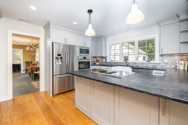 Chandelier, Interior, Kitchen, Pendant Lights, Recessed Lighting, Stainless Steel Appliances, Wood Texture Flooring