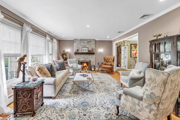 Fireplace, Interior, Living room, Recessed Lighting, Stone Walls, Wood Texture Flooring