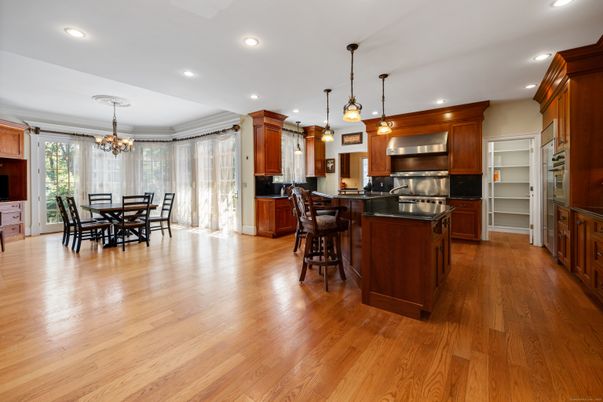 Chandelier, Dining room, Interior, Kitchen, Pendant Lights, Recessed Lighting, Stainless Steel Appliances, Wood Texture Flooring