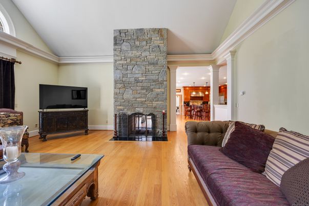 Fireplace, Interior, Living room, Recessed Lighting, Stone Walls, Wood Texture Flooring
