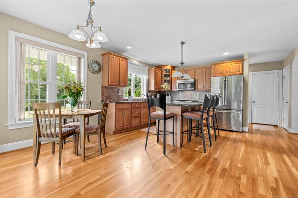 Dining room, Interior, Kitchen, Pendant Lights, Recessed Lighting, Stainless Steel Appliances, Wood Texture Flooring