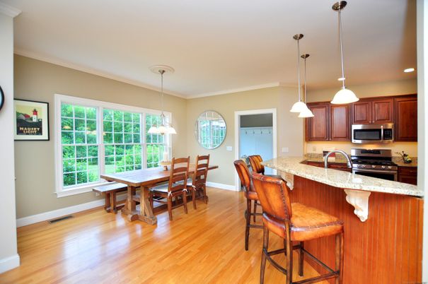 Dining room, Interior, Kitchen, Pendant Lights, Recessed Lighting, Stainless Steel Appliances, Wood Texture Flooring