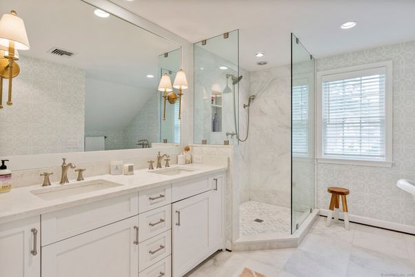 Bathroom, Dual Sink Vanities, Glass Shower, Interior, Marble, Marble Walls, Recessed Lighting