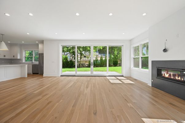 Empty room, Fireplace, Interior, Kitchen, Pendant Lights, Recessed Lighting, Wood Texture Flooring