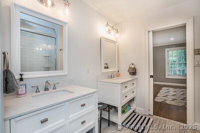 Bathroom, Dual Sink Vanities, Interior, Recessed Lighting, Wood Texture Flooring