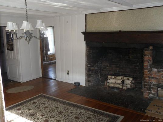 Chandelier, Fireplace, Interior, Stone Walls, Wood Texture Flooring