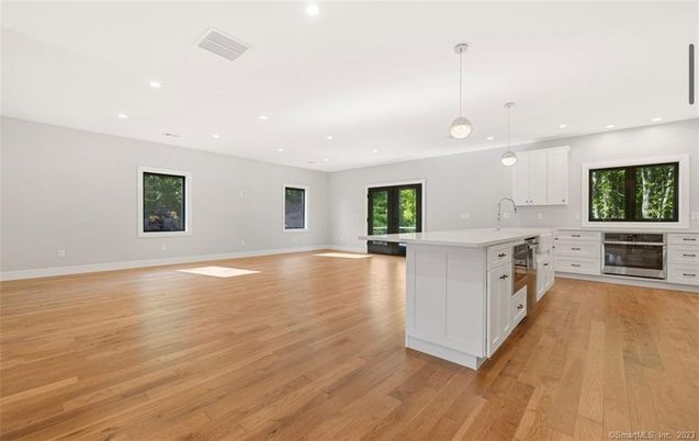 Empty room, Fireplace, Interior, Kitchen, Pendant Lights, Recessed Lighting, Wood Texture Flooring