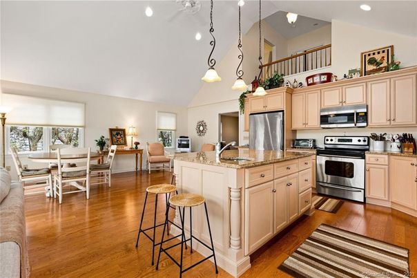 Dining room, Interior, Kitchen, Pendant Lights, Recessed Lighting, Stainless Steel Appliances, Wood Texture Flooring