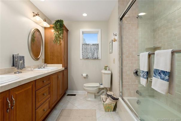 Bathroom, Dual Sink Vanities, Glass Shower, Interior, Recessed Lighting, Stone Walls