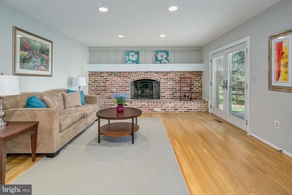 Fireplace, Interior, Living room, Recessed Lighting, Stone Walls, Wood Texture Flooring