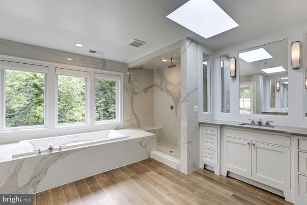 Bathroom, Glass Shower, Interior, Marble Walls, Recessed Lighting, Wood Texture Flooring