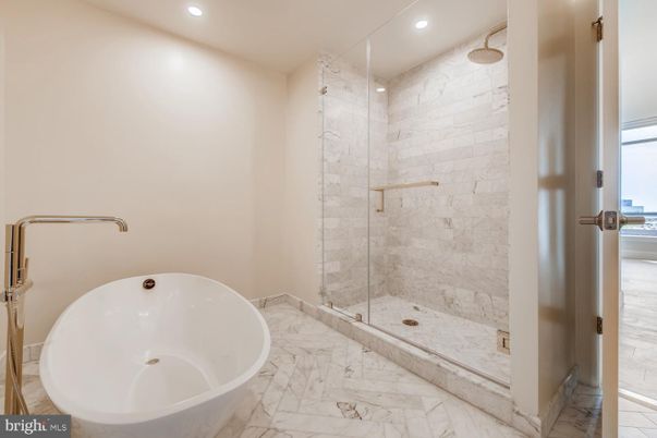 Bathroom, Free Standing Baths, Glass Shower, Interior, Marble, Marble Walls, Recessed Lighting