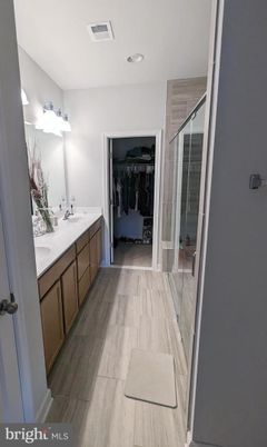 Bathroom, Dual Sink Vanities, Interior, Recessed Lighting, Wood Texture Flooring