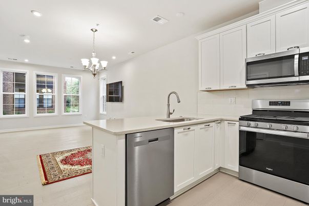 Chandelier, Interior, Kitchen, Pendant Lights, Recessed Lighting, Stainless Steel Appliances, Wood Texture Flooring