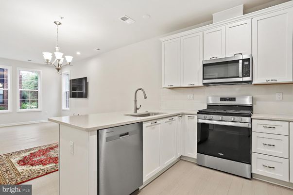 Chandelier, Interior, Kitchen, Pendant Lights, Recessed Lighting, Stainless Steel Appliances, Wood Texture Flooring