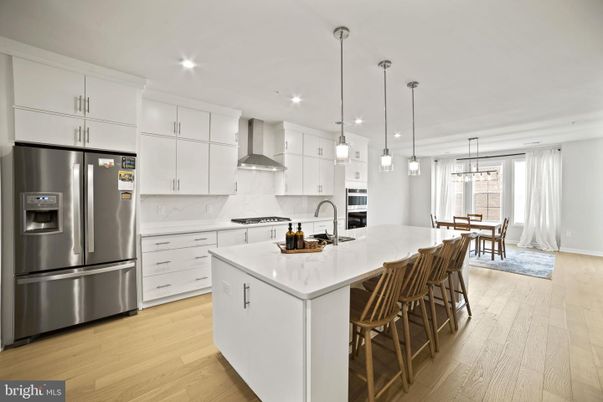 Dining room, Interior, Kitchen, Pendant Lights, Recessed Lighting, Stainless Steel Appliances, Wood Texture Flooring