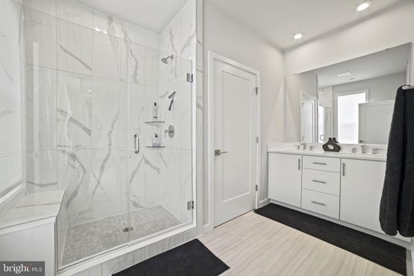 Bathroom, Dual Sink Vanities, Glass Shower, Interior, Marble Walls, Recessed Lighting