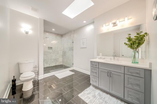 Bathroom, Dual Sink Vanities, Glass Shower, Interior, Marble Walls, Recessed Lighting